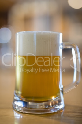Close-up of beer mug on table