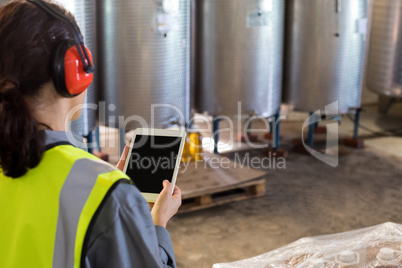 Female technician using digital tablet