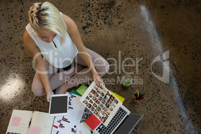 High angle view of businesswoman holding document at office