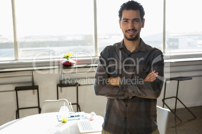 Portrait of confident man standing at office