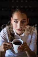 Woman having coffee in cafe