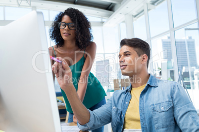 Executives working on computer in the office