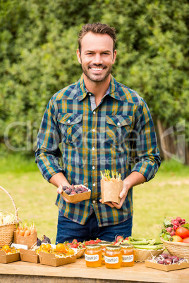 Portrait of man selling organic vegetable