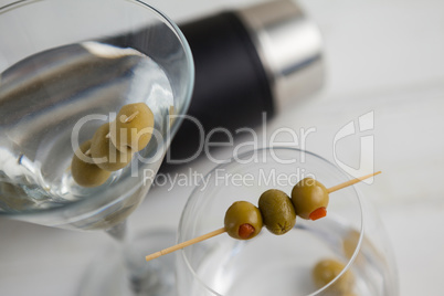 Close up of olives in vodka martini