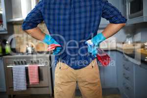 Midsection of man with cleaning equipment