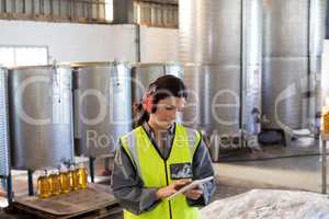 Female technician using digital tablet