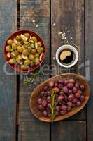 Directly above shot of olives with drink on table