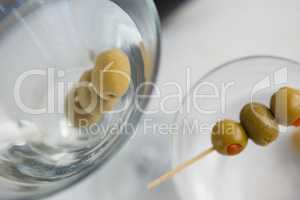 High angle view of olives in vodka martini