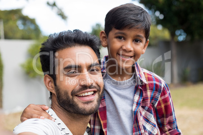 Close up portrait of happy father and son