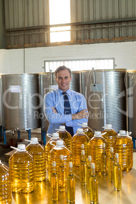 Portrait of manager standing with arms crossed