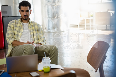 Man relaxing in office