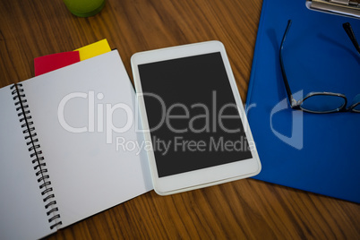 High angle view of tablet on table in office