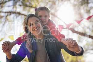 Mother and daughter enjoying together in the park