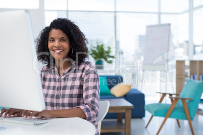 Female executive working on computer at desk