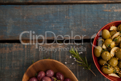 Cropped image of olives served in bowls