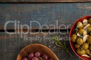 Cropped image of olives served in bowls