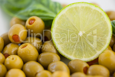 Close up of green olives with lemon