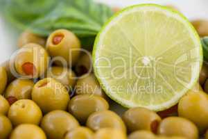 Close up of green olives with lemon