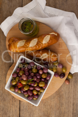 Overhead view of olives with bread