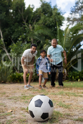 Family looking at soccer ball