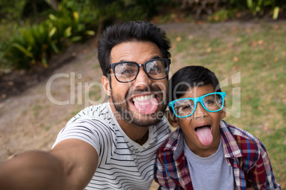 High angle view of father and son wearing sunglasses