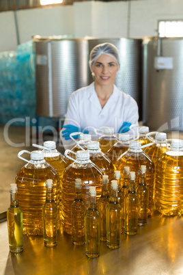 Portrait of confident female worker standing with arms crossed