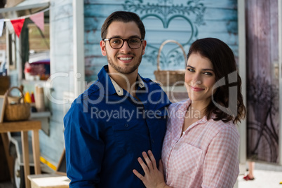 Smiling couple standing at restaurant