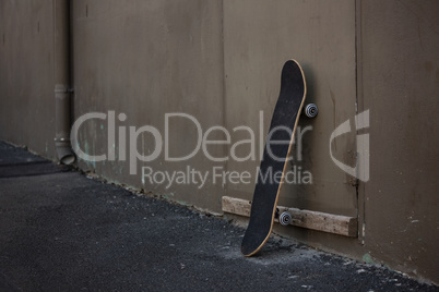 Skateboard by wall