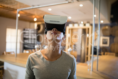 Man using virtual reality headset in restaurant