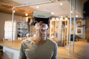 Man using virtual reality headset in restaurant