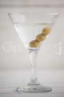 Close up of olives in martini glass