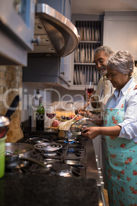 Man and woman preparing food at home