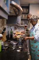 Man and woman preparing food at home