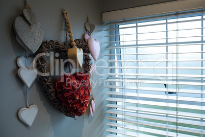 Close up of heart shape decoration hanging on wall
