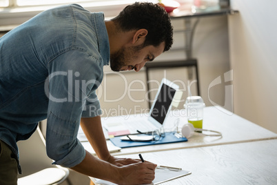 Concentrated man working in office