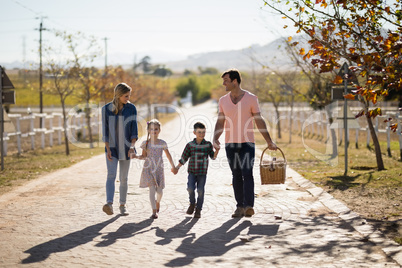 Happy family walking in the park