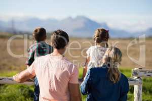 Rear view of family looking at nature in the park