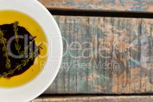 Cropped image of herbs in olive oil