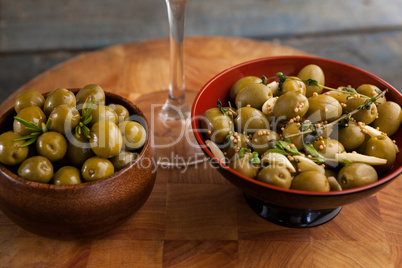 Close up of green olives served in container
