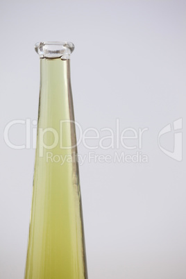 Close up of olive oil in glass bottle