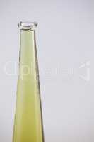 Close up of olive oil in glass bottle