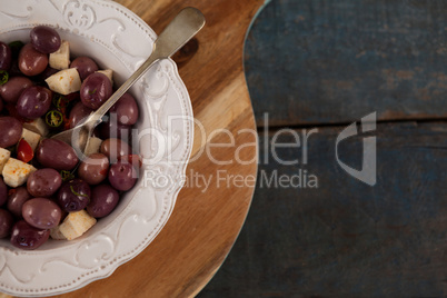 Cropped image of black olives served in plate on tray