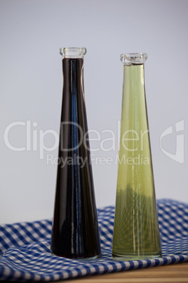 Close up of olive oil bottle on napkin