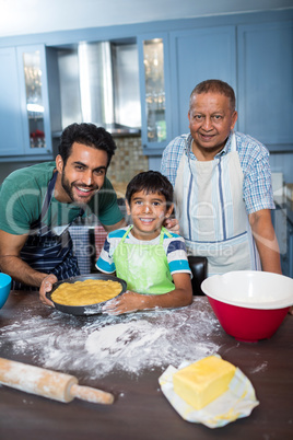 Portrait of happy family preparing food