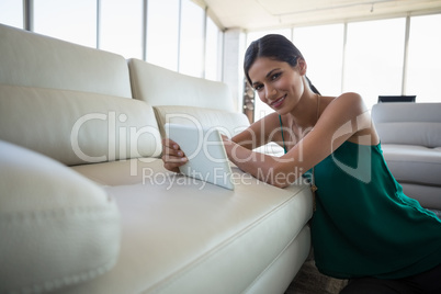 Portrait of smiling woman using digital tablet Portrait of smiling woman using digital tablet