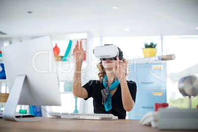 Female designer using virtual reality headset