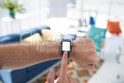 Male executive using smartwatch