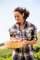 Smiling woman with apple basket