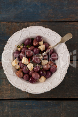 Black olives with cheese served in plate