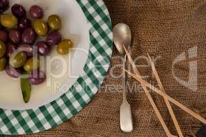 Cropped image of olives served in plate